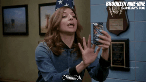 GIF of Gina Linetti (Brooklyn 99) taking a photo with her phone. Caption says, “Cliiiiiiiiick.”